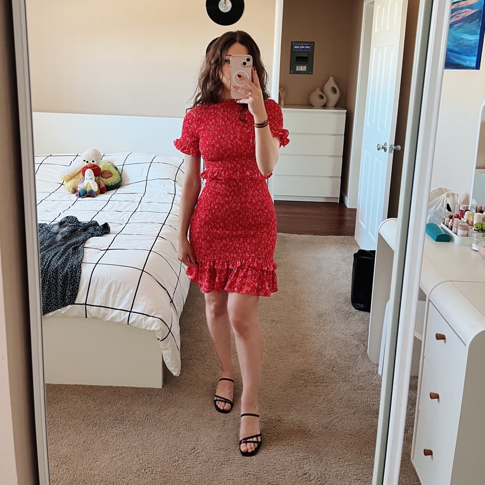 Likely designer red dress